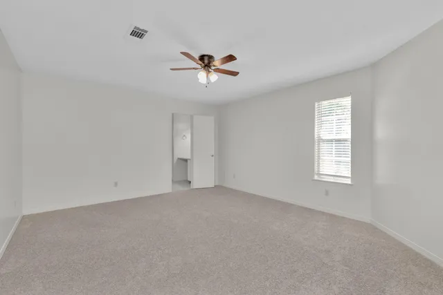 a view of an empty room with a window
