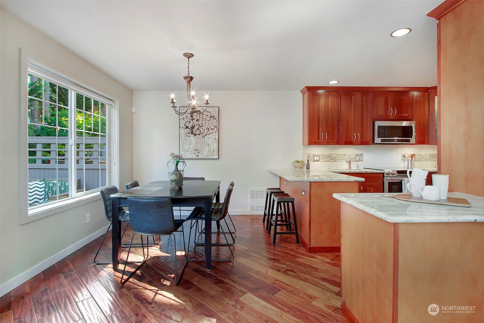 530 Elma Place Northeast Renton, WA 98059 - Photo 11 of 32 a view of a dining room with furniture window and wooden floor