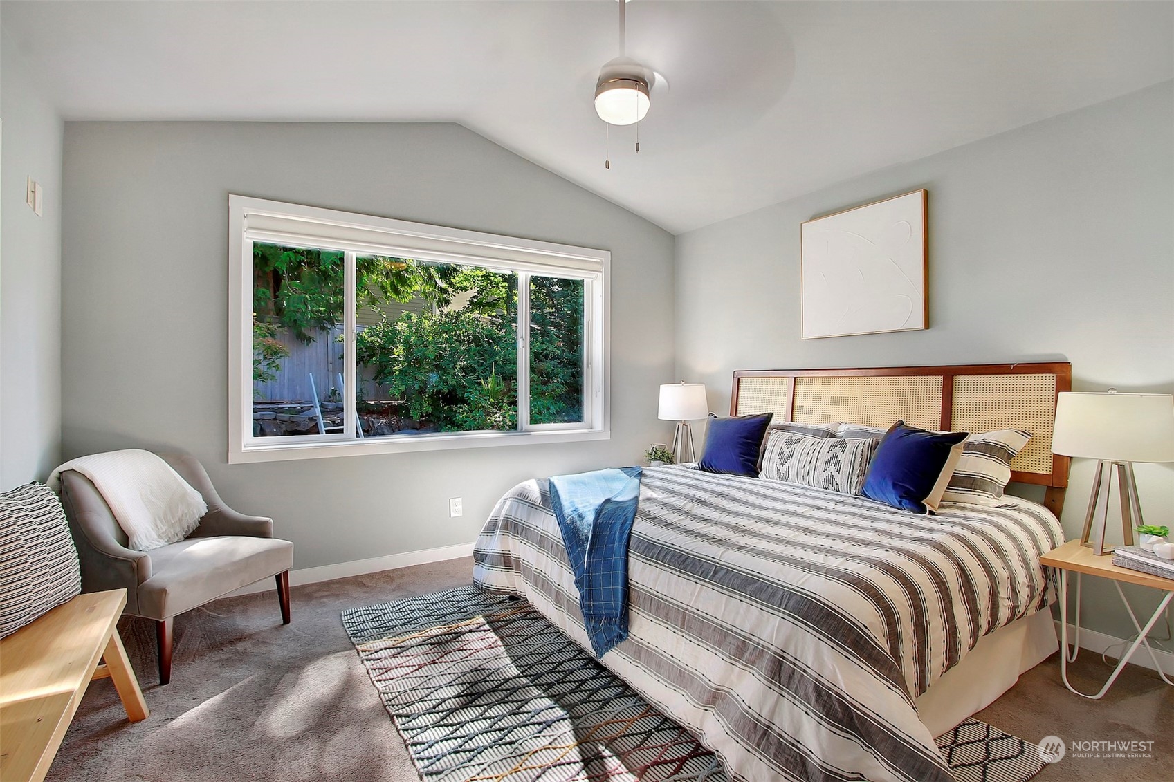 530 Elma Place Northeast Renton, WA 98059 - Photo 18 of 32 a bedroom with a bed and a large window