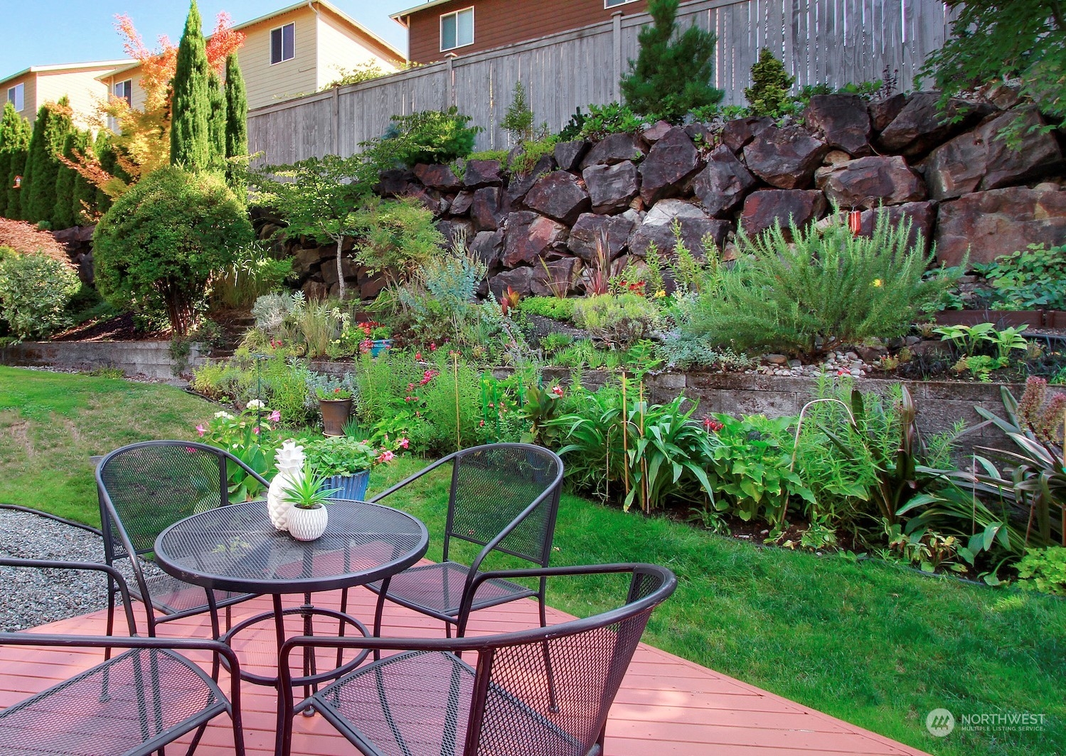 530 Elma Place Northeast Renton, WA 98059 - Photo 30 of 32 a view of a chairs and table in the garden