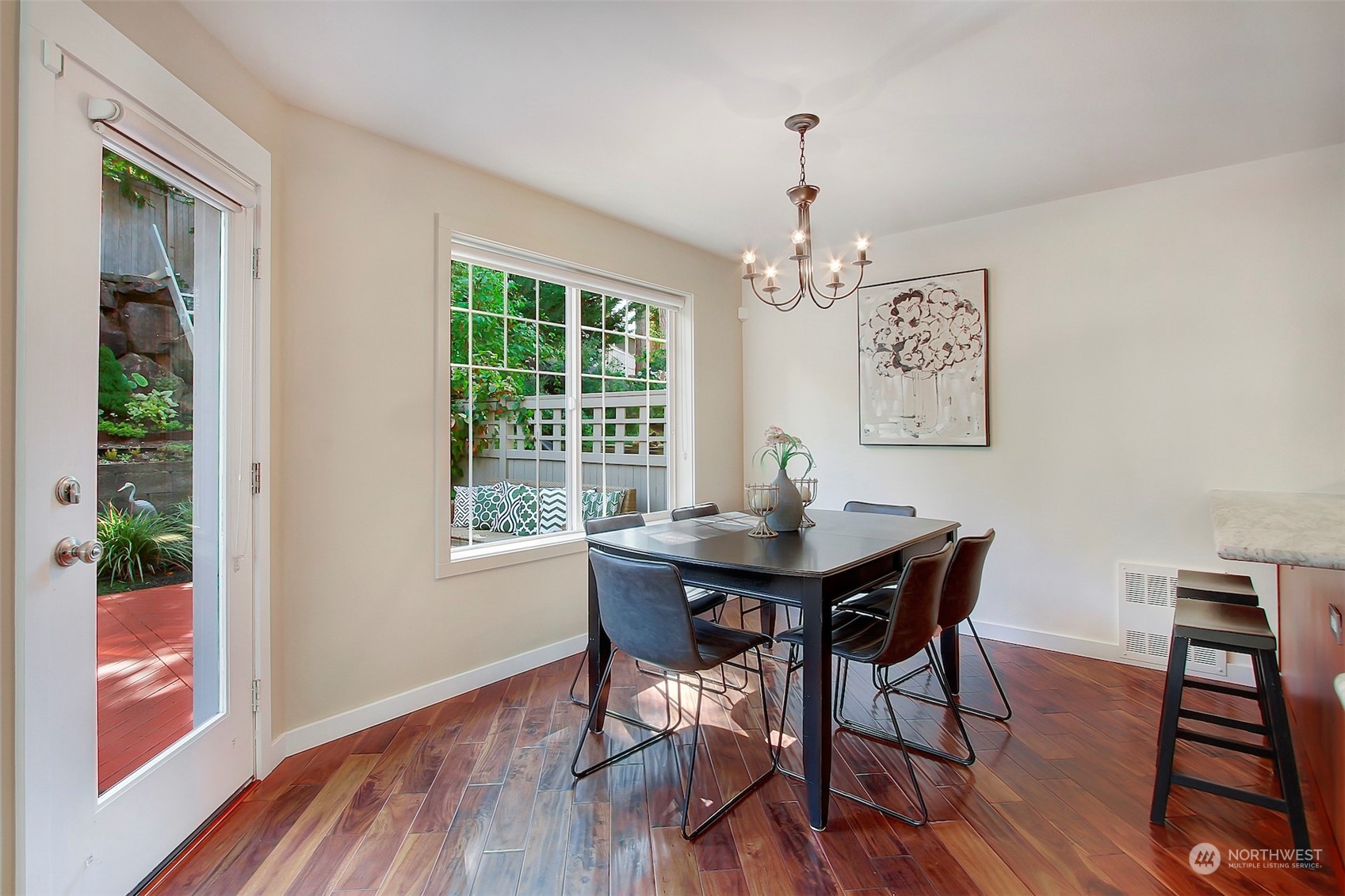 530 Elma Place Northeast Renton, WA 98059 - Photo 9 of 32 a view of a dining room with furniture window and wooden floor
