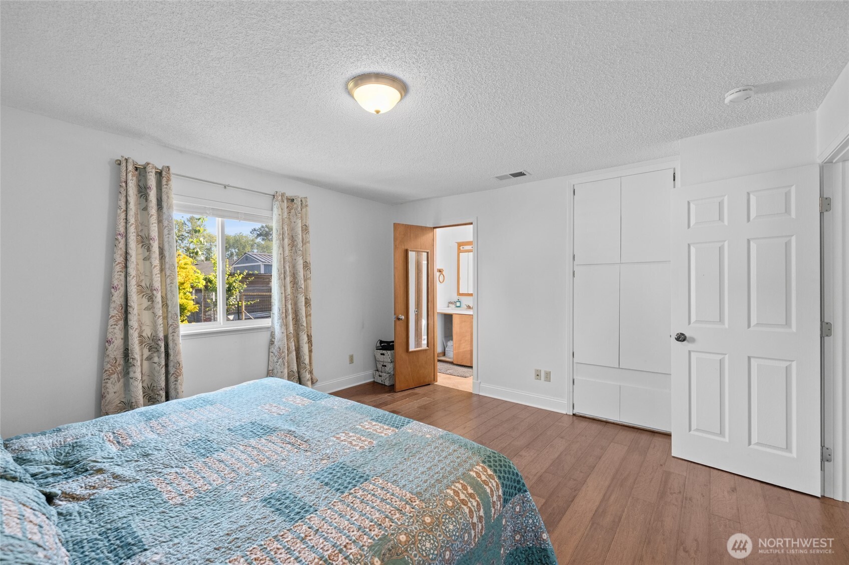 415 Sterling Street Sedro-Woolley, WA 98284 - Photo 24 of 38 a bedroom with a bed and a window