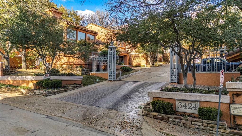 3424 Gillespie Street, Unit 5 Dallas, TX 75219 - Photo 1 of 31 a front view of a house with a yard