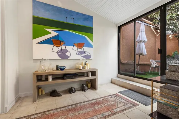 a kitchen with granite countertop stainless steel appliances cabinets a sink and a window