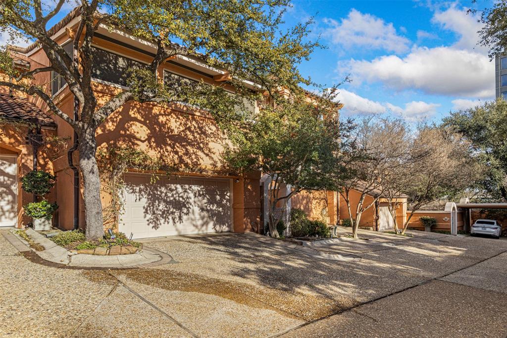 3424 Gillespie Street, Unit 5 Dallas, TX 75219 - Photo 2 of 31 a view of street with trees