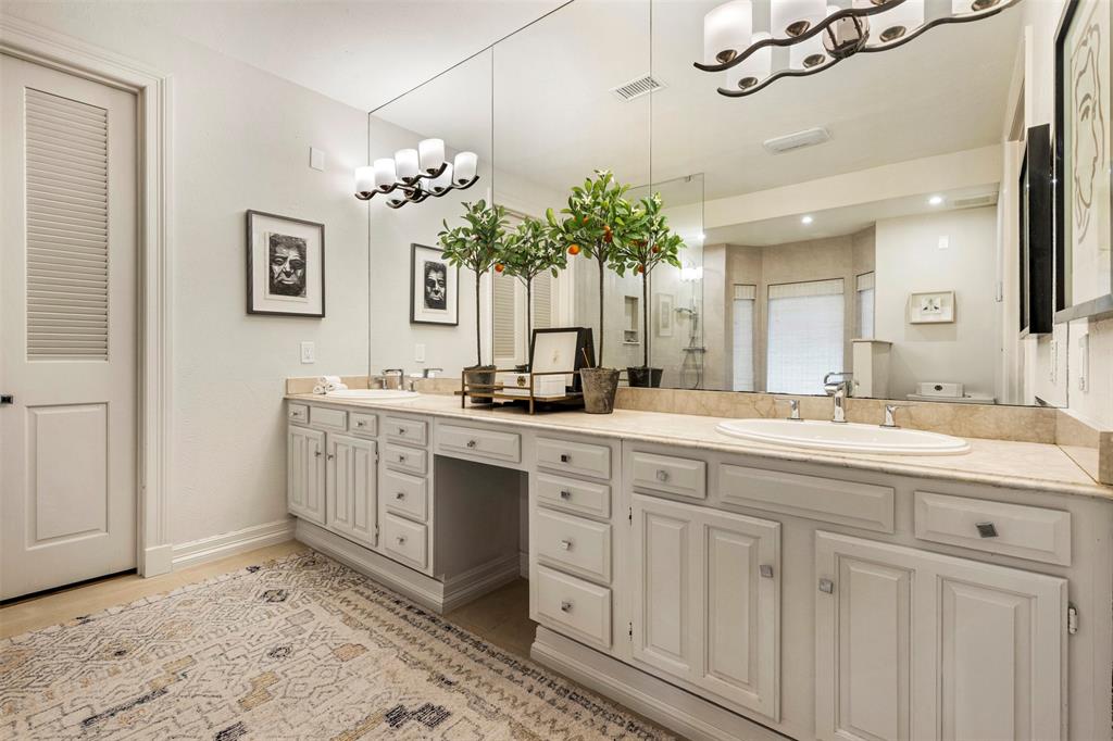 3424 Gillespie Street, Unit 5 Dallas, TX 75219 - Photo 21 of 31 a bathroom with a sink and a mirror