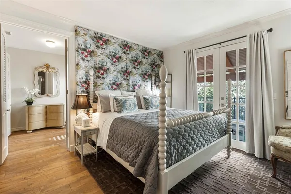 a bathroom with a glass door shower and a sink