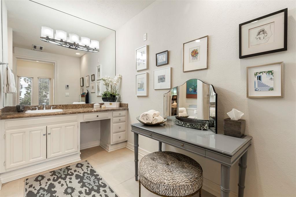 3424 Gillespie Street, Unit 5 Dallas, TX 75219 - Photo 26 of 31 a bathroom with a granite countertop sink and a mirror
