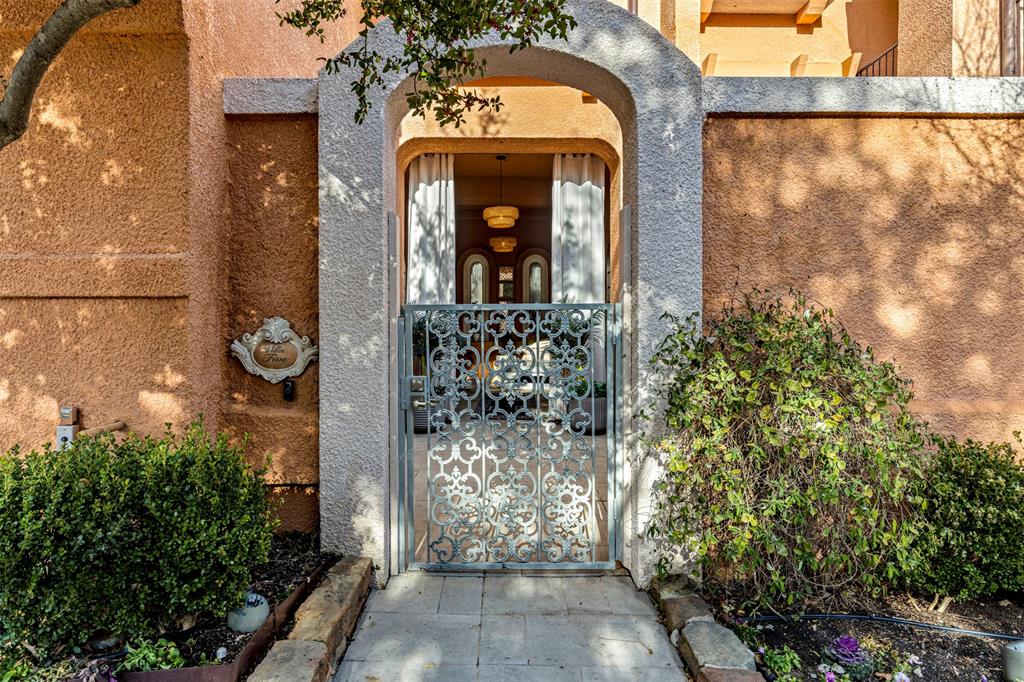 3424 Gillespie Street, Unit 5 Dallas, TX 75219 - Photo 4 of 31 a view of a wooden door with a tree in front of it