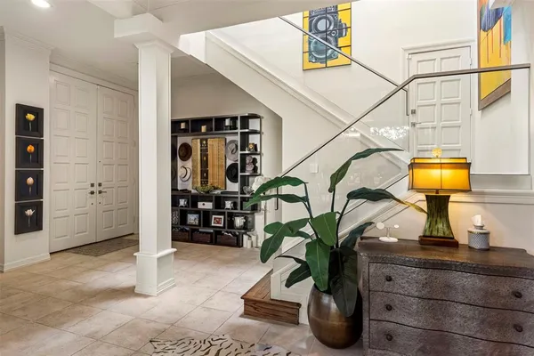 a living room with furniture a fireplace and wall paintings