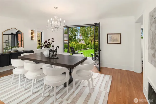 a view of a dining room with furniture window and wooden floor
