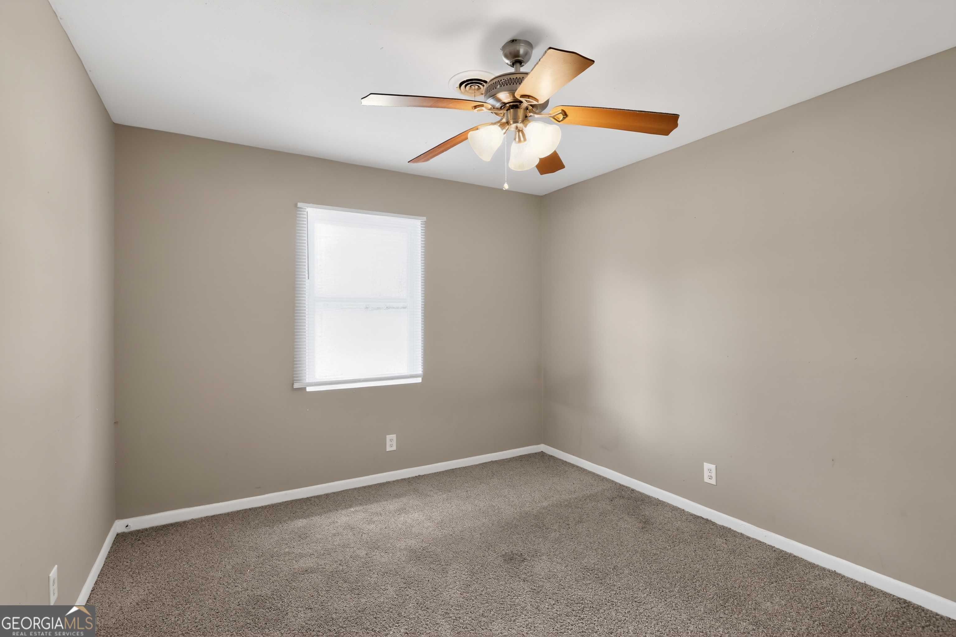 3606 Alene Circle Augusta, GA 30906 - Photo 5 of 30 an empty room with window and ceiling fan
