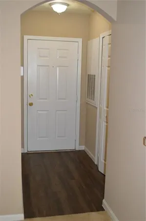 a kitchen with stainless steel appliances granite countertop a stove top oven a sink a dining table and chairs