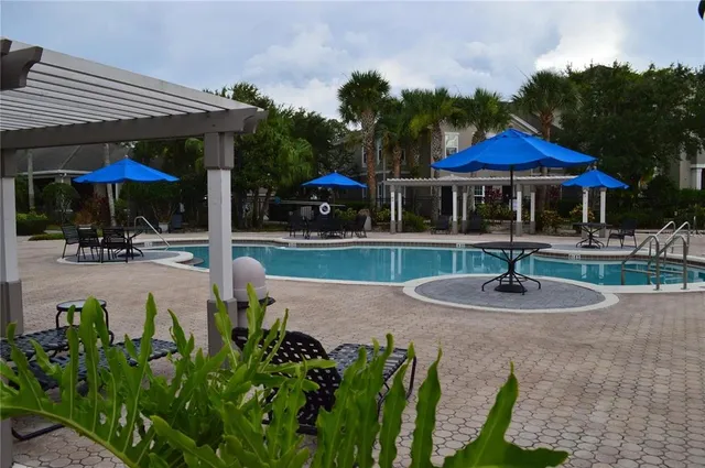 a front view of a building with trees