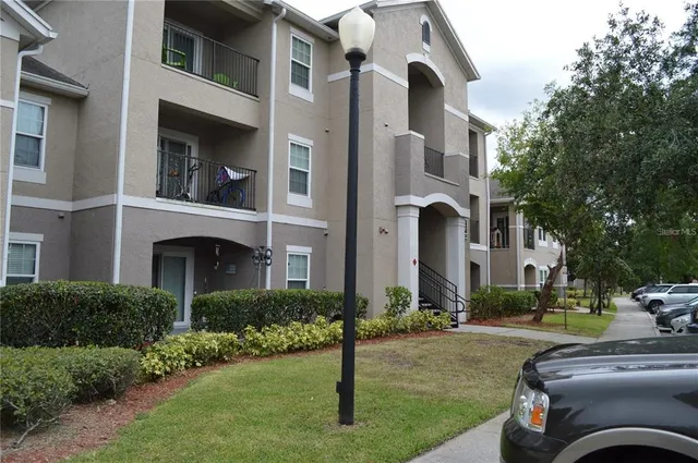 a view of a building with a yard