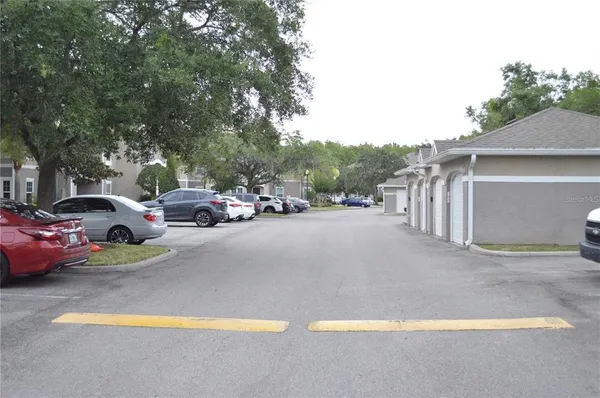 a view of street with parked cars