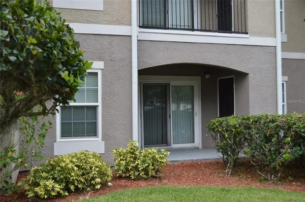 front view of a house with potted plants
