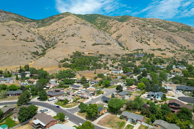 120 North 1230 E Street Springville, UT 84663 - Photo 47 of 60 Residential neighborhood featuring varied architectural styles and mature trees, set against a backdrop of natural mountainous terrain