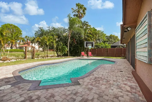 a view of swimming pool with a yard