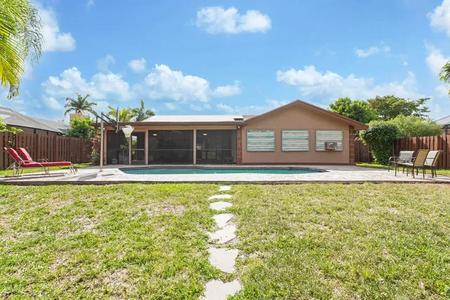 a view of house with a swimming pool
