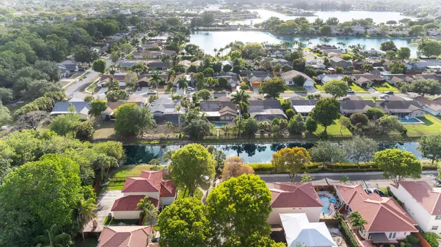 an aerial view of residential houses with outdoor space