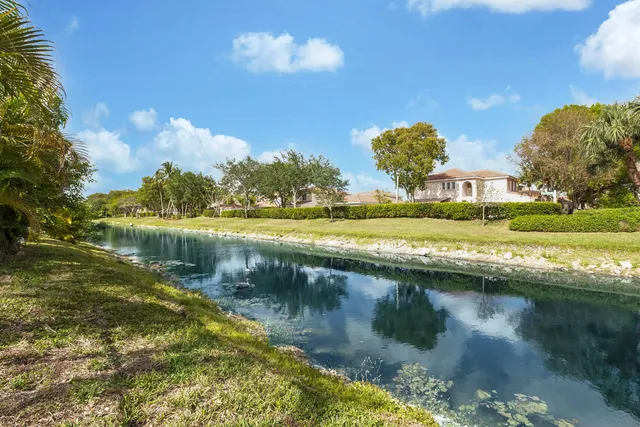 a view of a lake in front of a house with a lake view