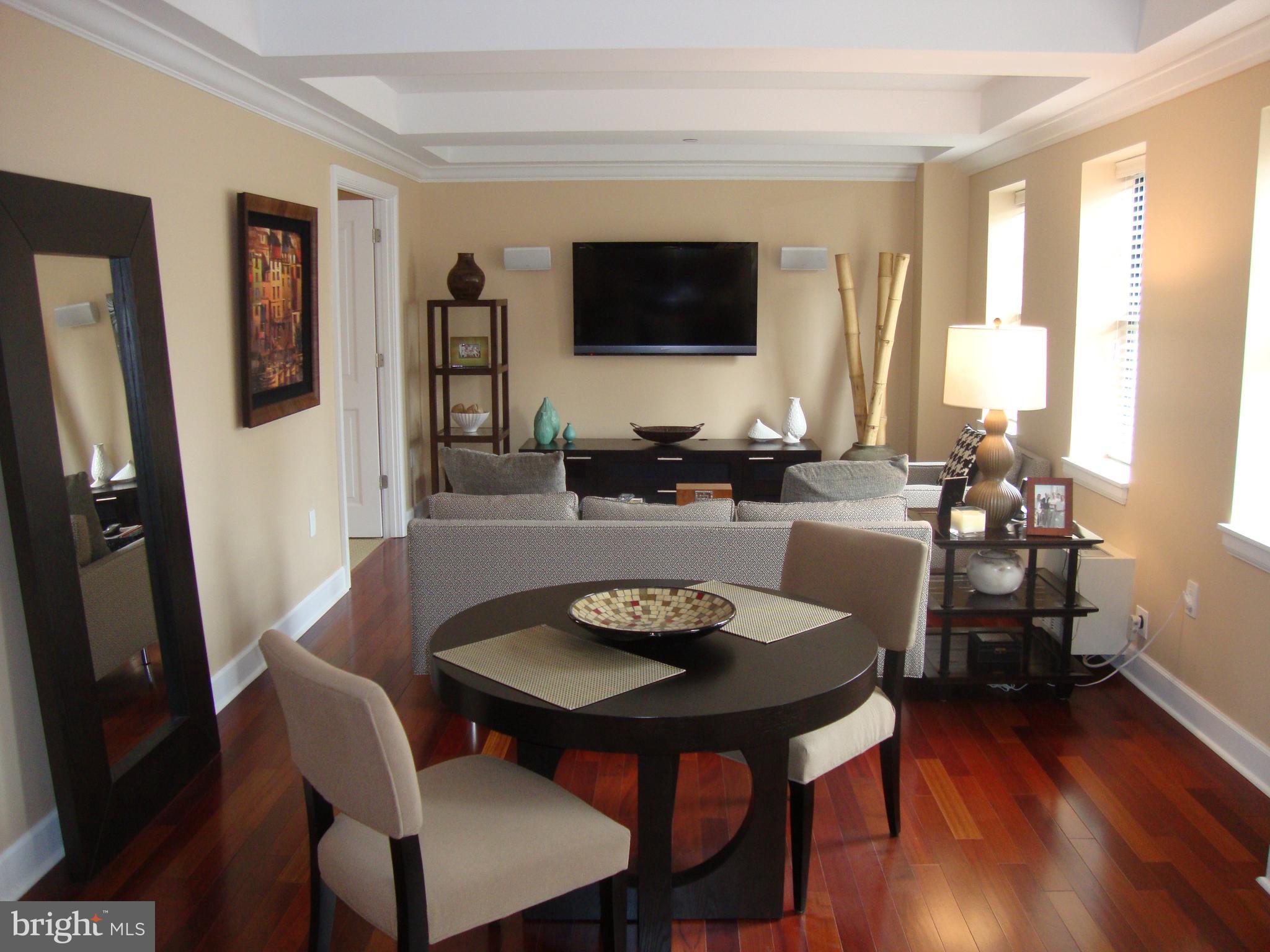 1701-15 Locust Street, Unit 1402 Philadelphia, PA 19103 - Photo 1 of 17 a view of a dining room with furniture and wooden floor