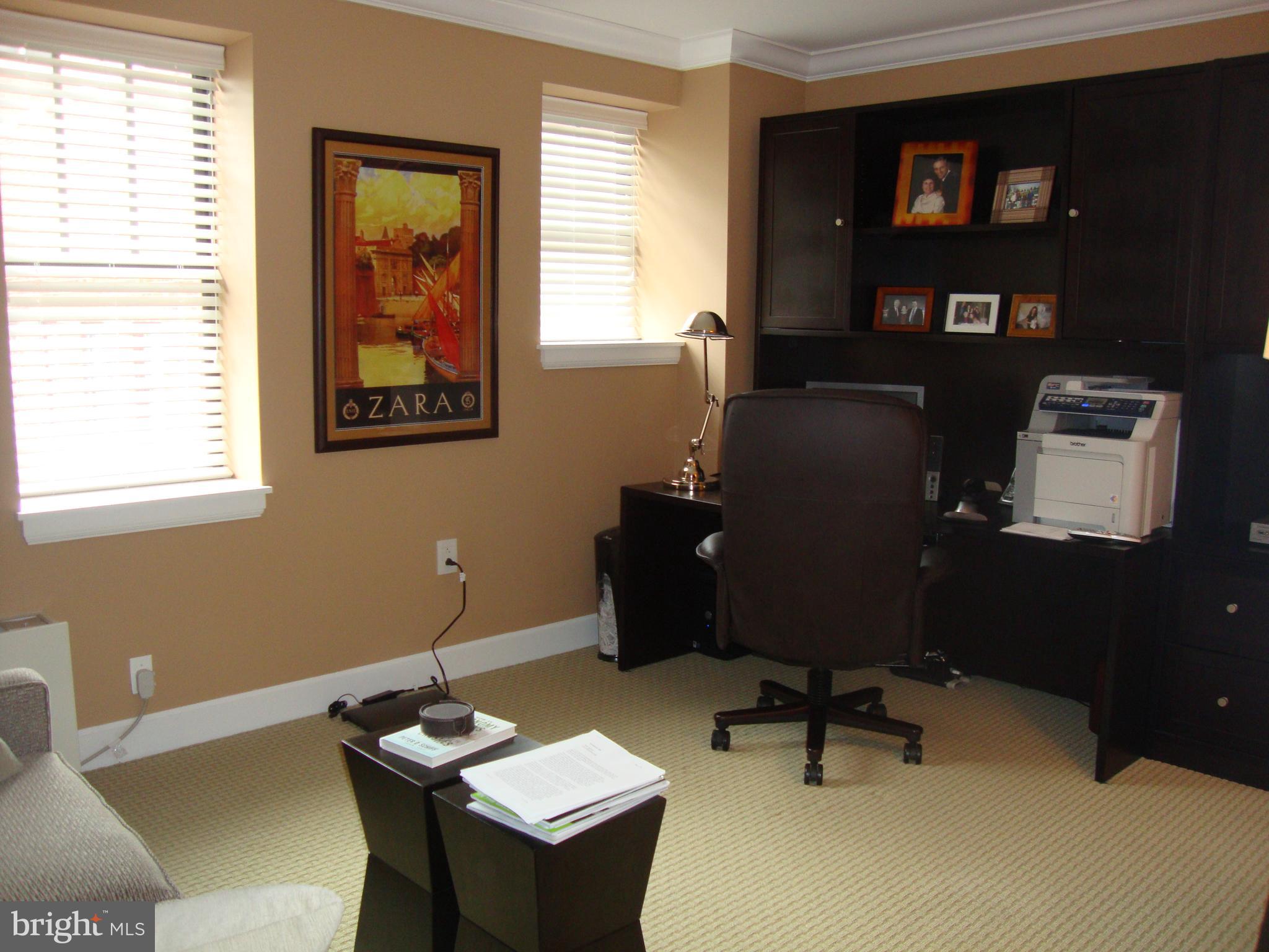1701-15 Locust Street, Unit 1402 Philadelphia, PA 19103 - Photo 9 of 17 a workspace with furniture and window