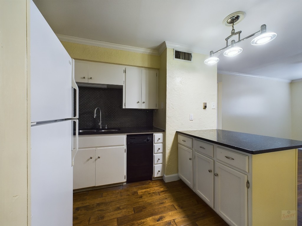 803 West 28th Street, Unit 206 Austin, TX 78705 - Photo 2 of 20 a kitchen with granite countertop a sink and cabinets