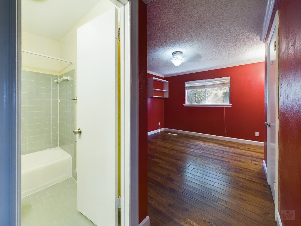 803 West 28th Street, Unit 206 Austin, TX 78705 - Photo 10 of 20 a view of a hallway with wooden floor