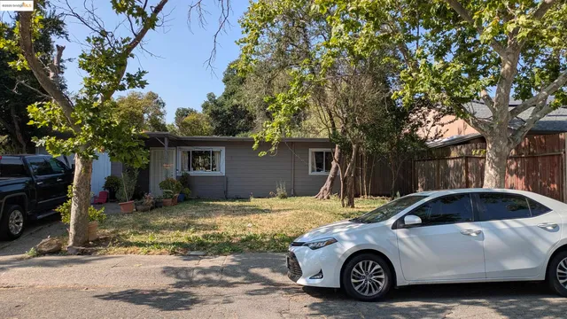 a car parked in front of a house