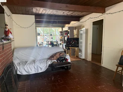 a row of palm trees in front of a house