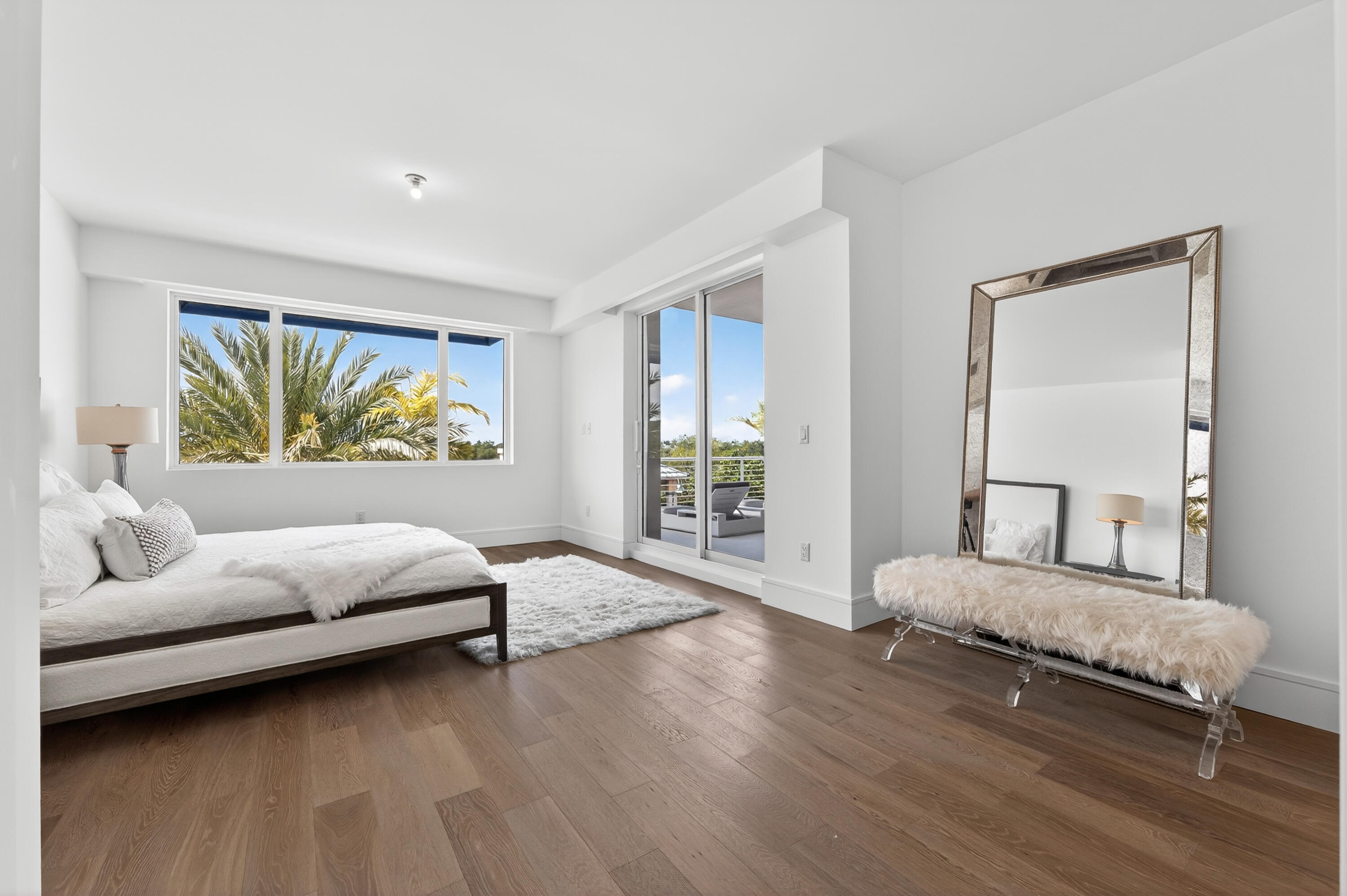 1 South Coastal Way, Unit 201 Jupiter, FL 33477 - Photo 14 of 40 a bedroom with a bed and a couch