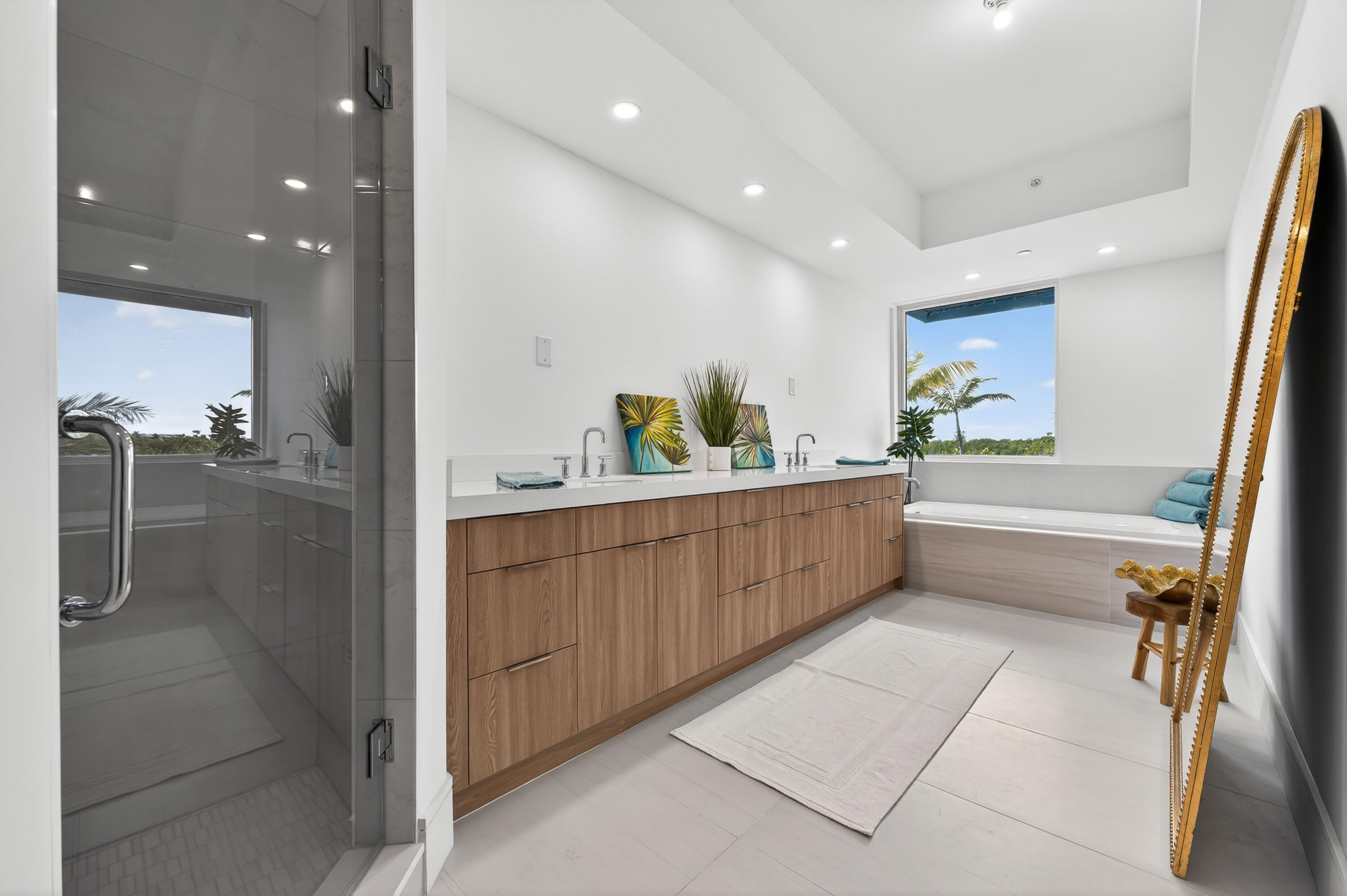 1 South Coastal Way, Unit 201 Jupiter, FL 33477 - Photo 17 of 40 a bathroom with a tub sink and mirror