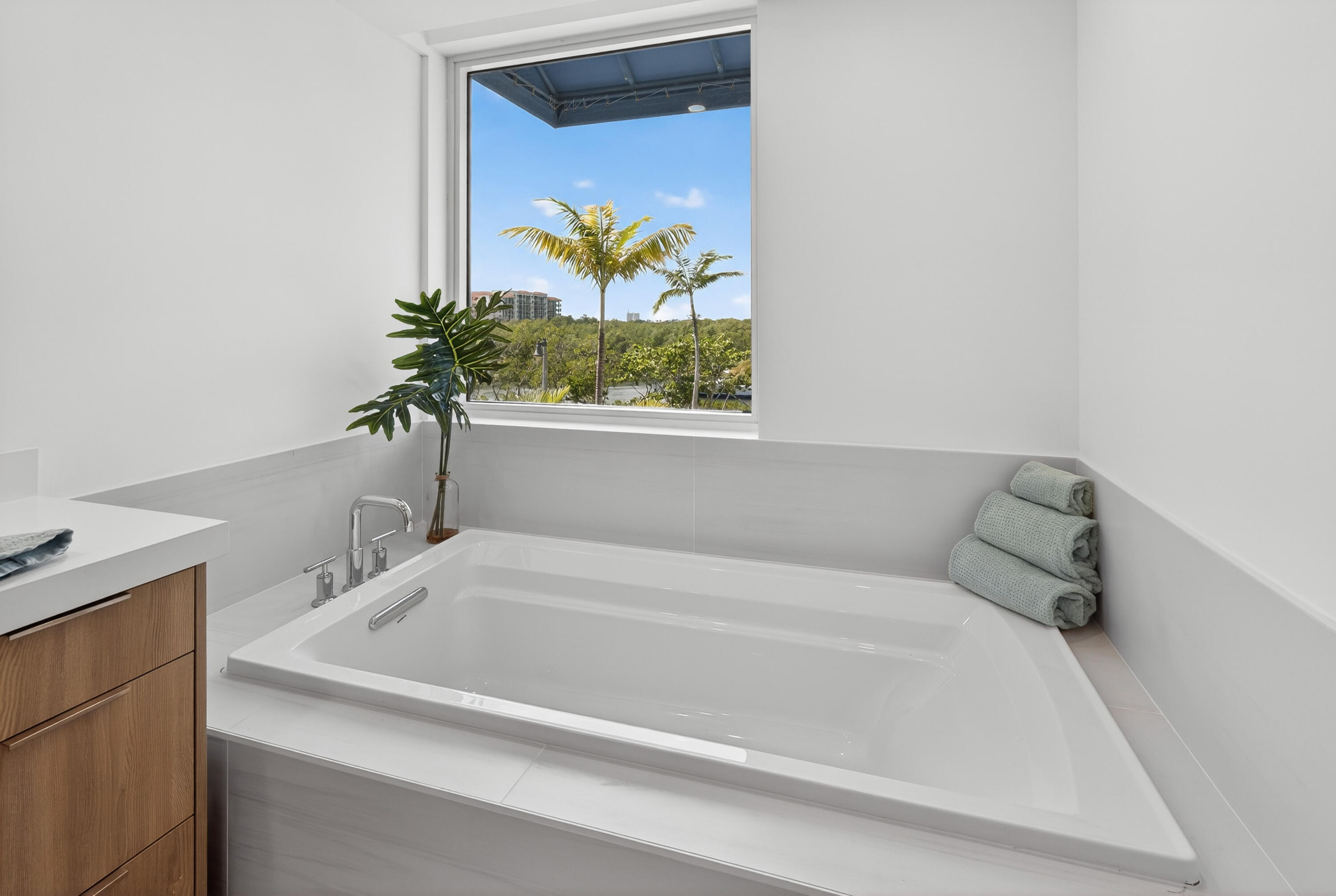 1 South Coastal Way, Unit 201 Jupiter, FL 33477 - Photo 18 of 40 a white bath tub with a window