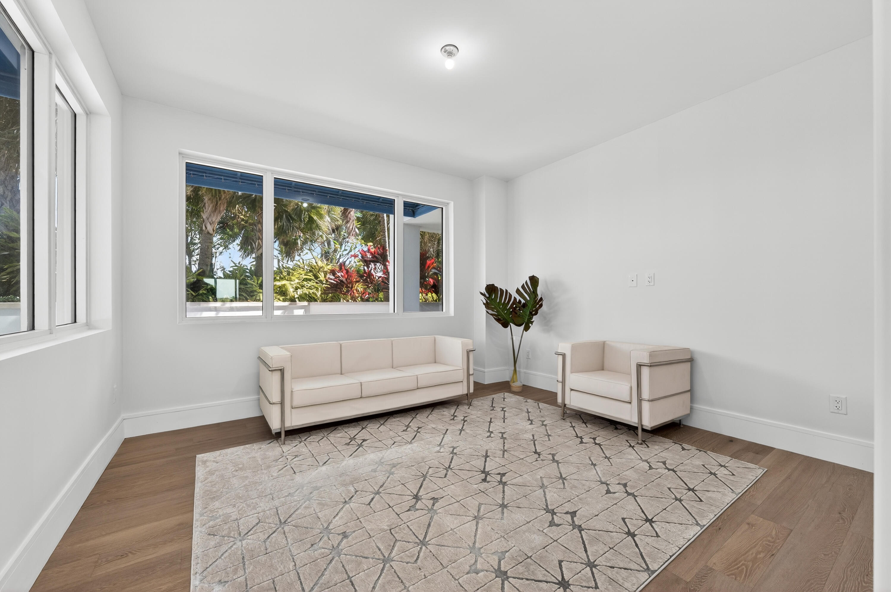 1 South Coastal Way, Unit 201 Jupiter, FL 33477 - Photo 19 of 40 a living room with furniture and a large window
