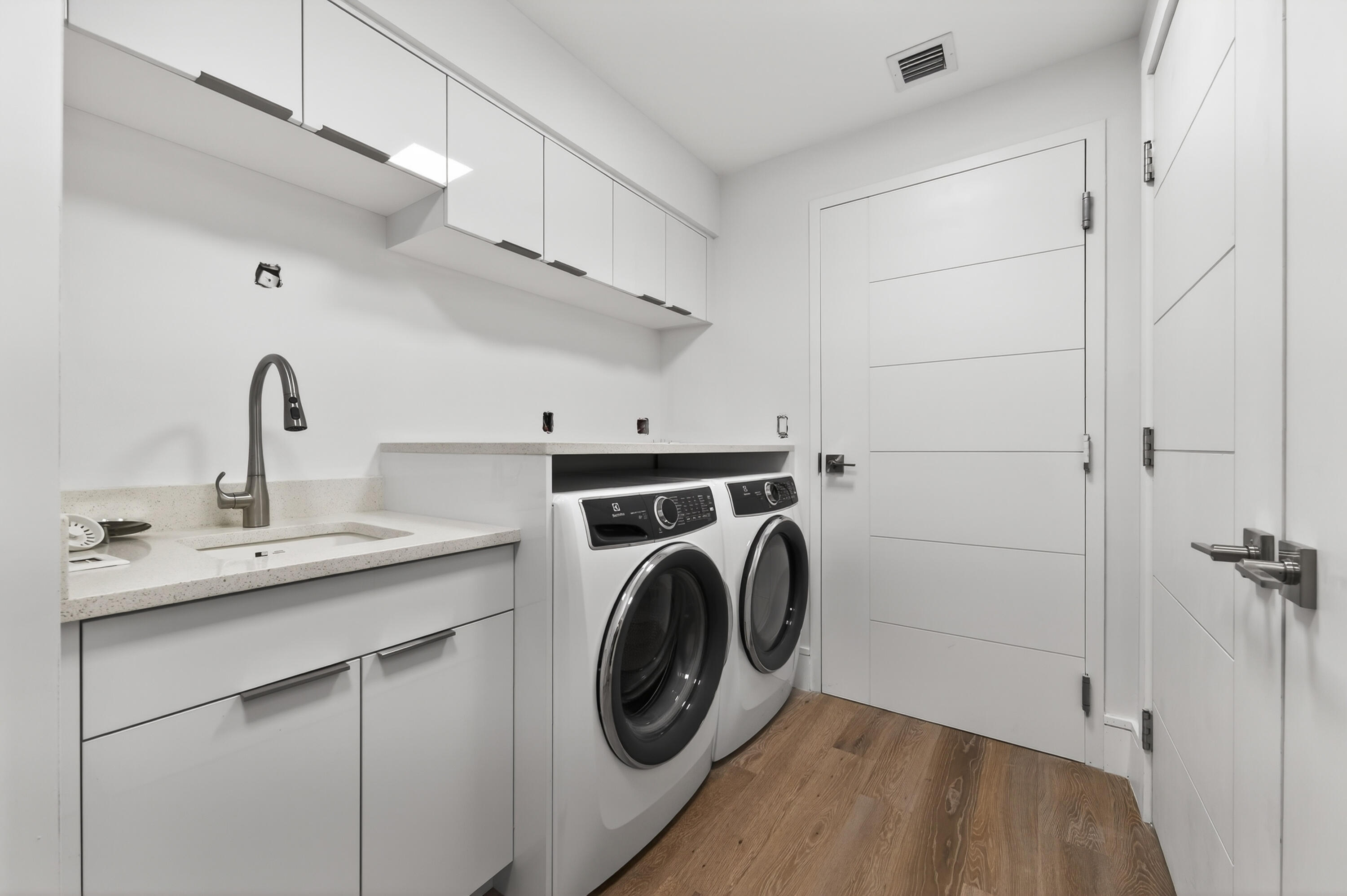 1 South Coastal Way, Unit 201 Jupiter, FL 33477 - Photo 25 of 40 a utility room with sink dryer and washer