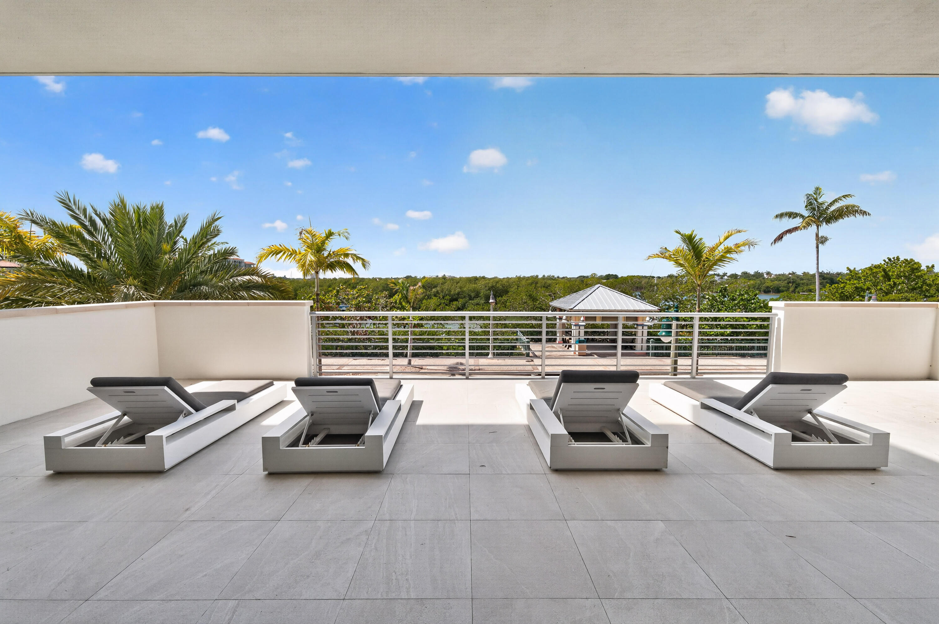 1 South Coastal Way, Unit 201 Jupiter, FL 33477 - Photo 29 of 40 a view of a patio with couches and potted plants
