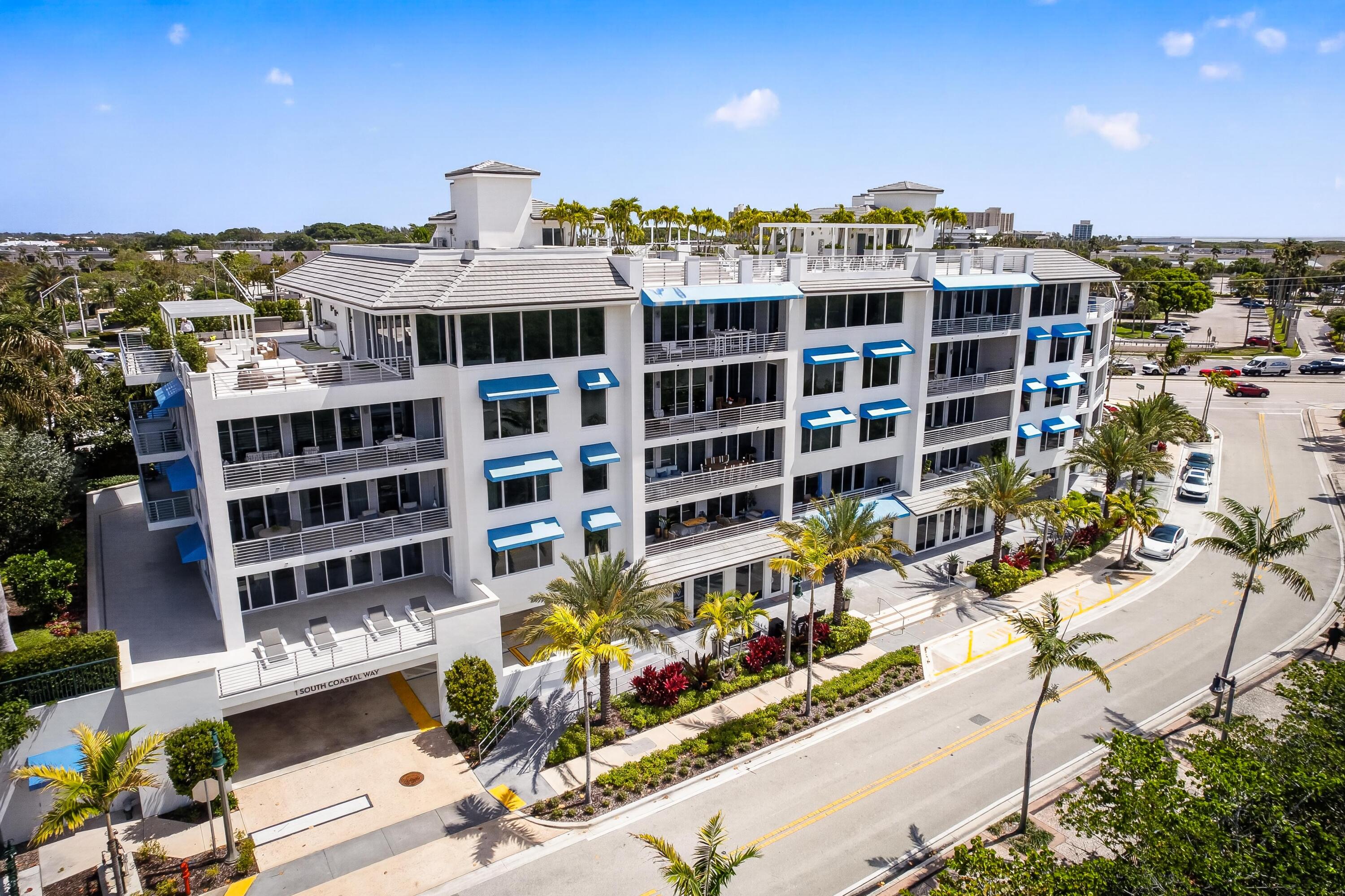 1 South Coastal Way, Unit 201 Jupiter, FL 33477 - Photo 34 of 40 a front view of a building with street view