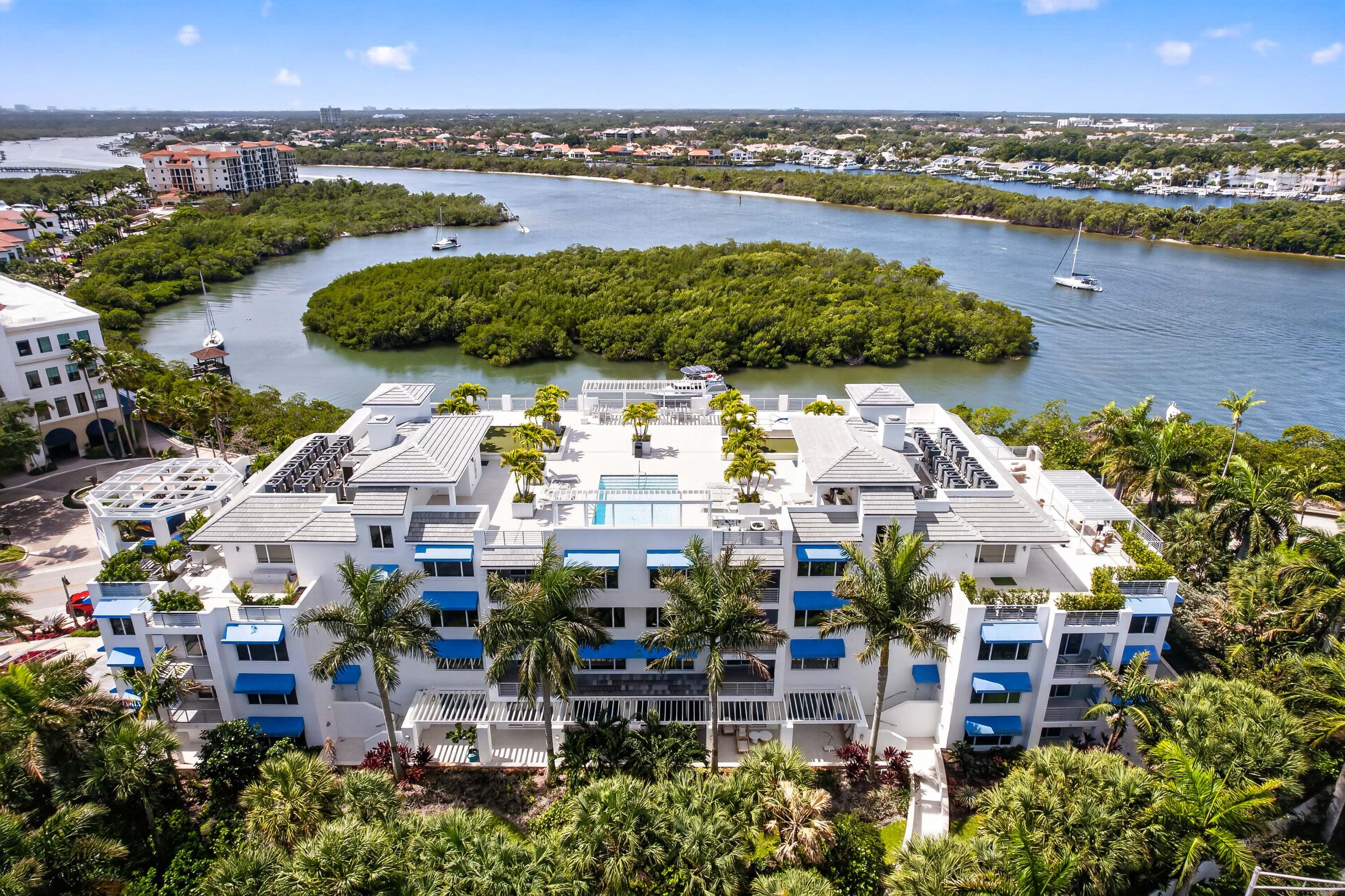 1 South Coastal Way, Unit 201 Jupiter, FL 33477 - Photo 36 of 40 an aerial view of a city with swimming pool and outdoor seating