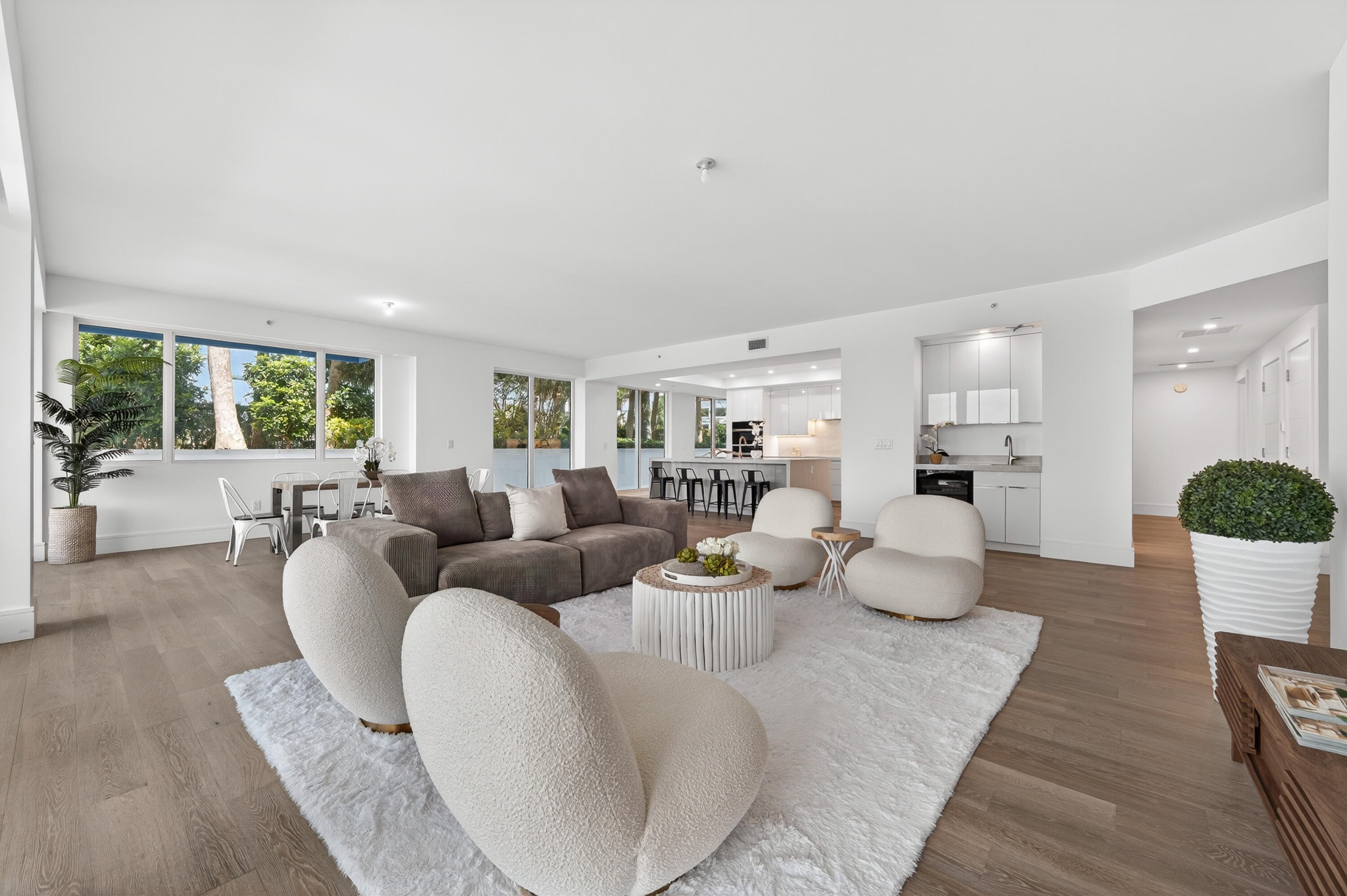1 South Coastal Way, Unit 201 Jupiter, FL 33477 - Photo 6 of 40 a living room with furniture and a wooden floor