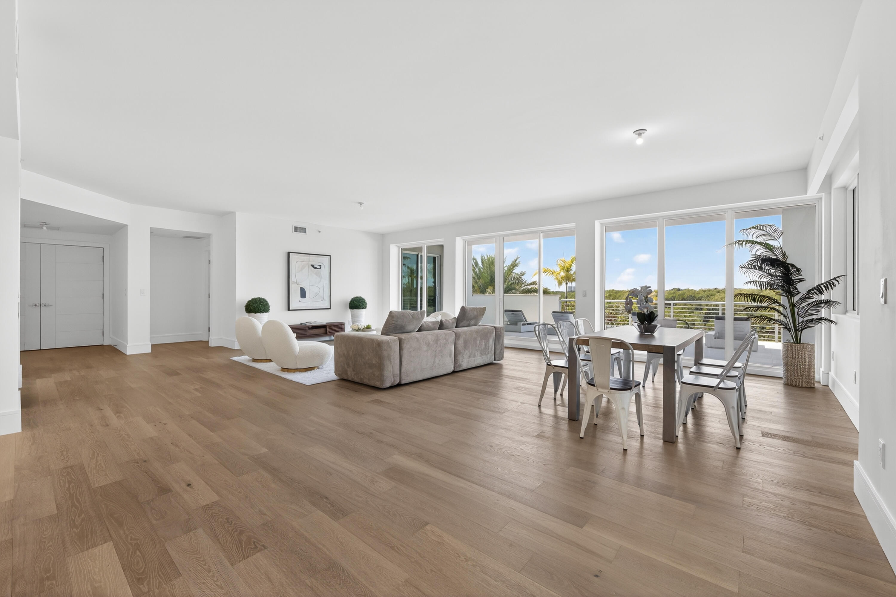 1 South Coastal Way, Unit 201 Jupiter, FL 33477 - Photo 9 of 40 a living room with furniture and a table