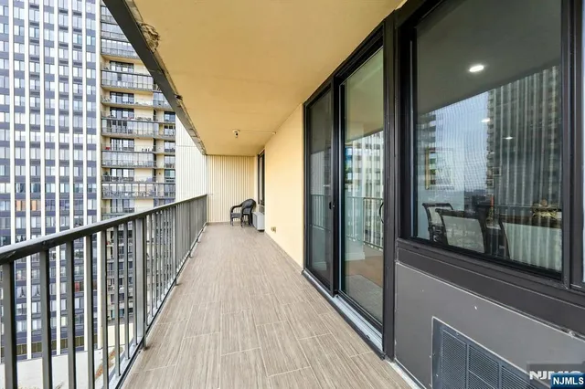 an aerial view of a balcony with city view