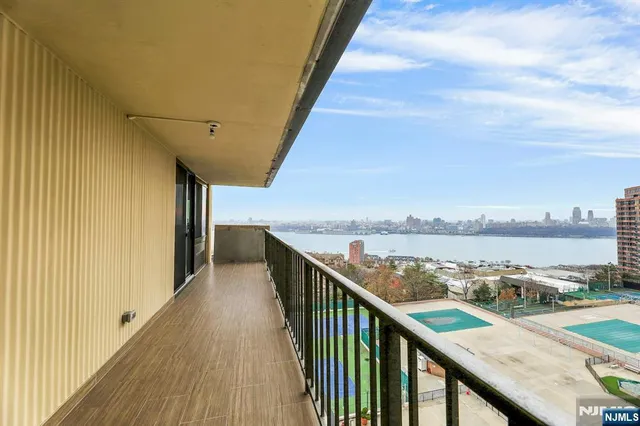 a view of a balcony with city view
