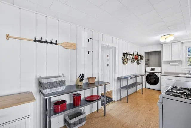 a kitchen with a stove and a refrigerator