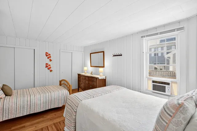 a bedroom with a large bed and a couch