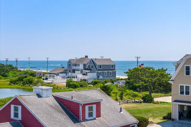 a aerial view of a house with a yard