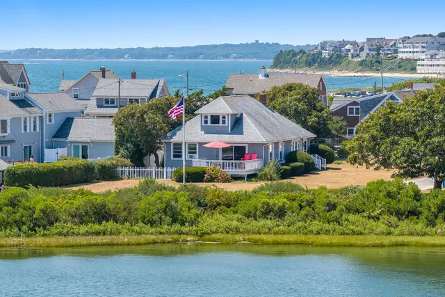 an aerial view of a house with a lake view