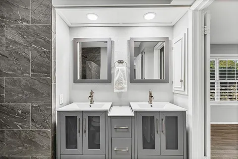 a bathroom with a sink and a mirror