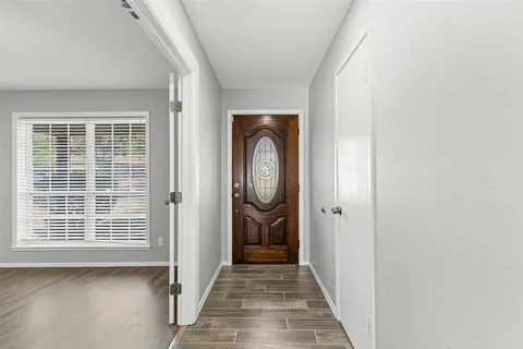 a view of an entryway door with a window